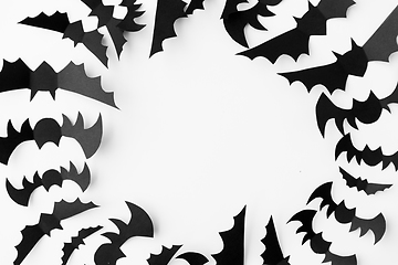 Image showing flock of black paper bats over white background