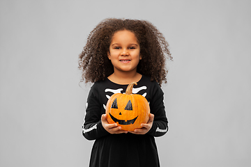 Image showing girl in black halloween dress with jack-o-lantern