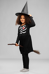 Image showing girl in black witch hat with broom on halloween