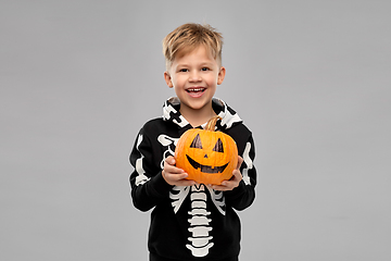 Image showing happy boy in halloween costume with jack-o-lantern