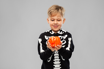 Image showing happy boy in halloween costume with jack-o-lantern