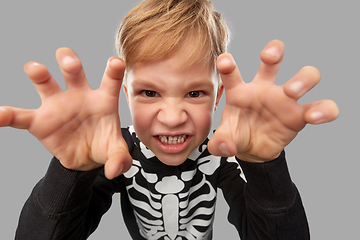 Image showing boy in halloween costume of skeleton making faces