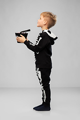 Image showing boy with candies trick-or-treating on halloween