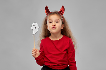 Image showing girl in halloween costume with ghost party prop