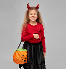 Image showing girl with horns trick-or-treating on halloween