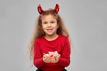 Image showing girl with horns trick-or-treating on halloween