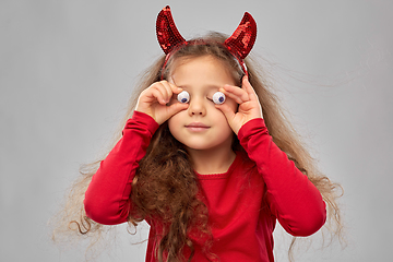 Image showing girl in halloween costume and devil's horns