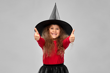 Image showing happy girl in black witch hat on halloween