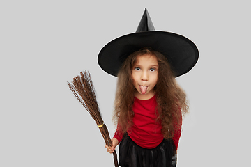 Image showing girl in black witch hat with broom on halloween