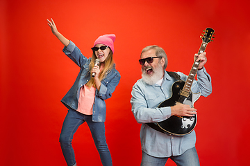 Image showing Senior man, grandfather having fun and spending time together with girl, granddaughter. Joyful elderly lifestyle concept