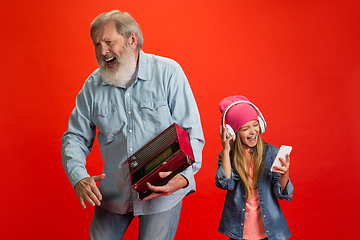 Image showing Senior man, grandfather having fun and spending time together with girl, granddaughter. Joyful elderly lifestyle concept