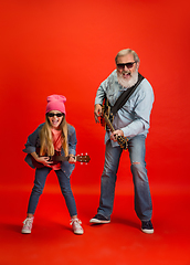 Image showing Senior man, grandfather having fun and spending time together with girl, granddaughter. Joyful elderly lifestyle concept