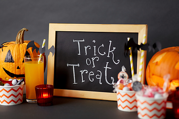 Image showing pumpkins, candies and halloween decorations