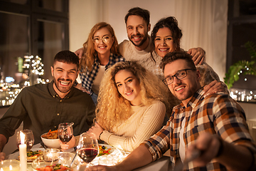 Image showing friends taking selfie at christmas dinner party