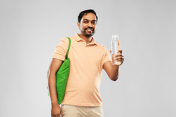 Image showing man with bag for food shopping and glass bottle