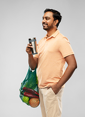 Image showing man with food in bag and tumbler or thermo cup