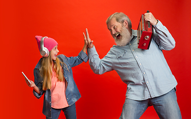 Image showing Senior man, grandfather having fun and spending time together with girl, granddaughter. Joyful elderly lifestyle concept