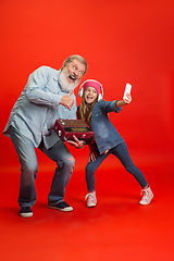 Image showing Senior man, grandfather having fun and spending time together with girl, granddaughter. Joyful elderly lifestyle concept