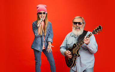 Image showing Senior man, grandfather having fun and spending time together with girl, granddaughter. Joyful elderly lifestyle concept