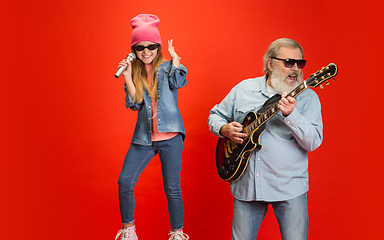 Image showing Senior man, grandfather having fun and spending time together with girl, granddaughter. Joyful elderly lifestyle concept