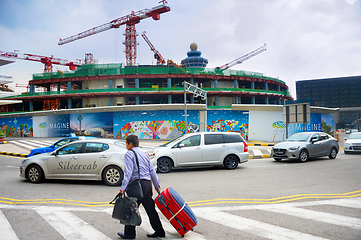 Image showing Man luggage airport construction Singapore