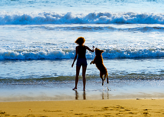 Image showing Woman with dog at beach