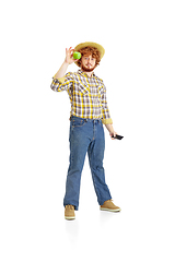 Image showing Handsome farmer, rancher isolated over white studio background