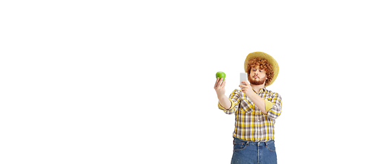 Image showing Handsome farmer, rancher isolated over white studio background