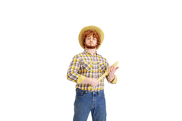 Image showing Handsome farmer, rancher isolated over white studio background