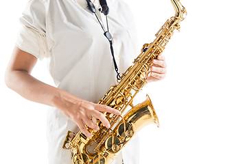 Image showing Close up woman playing saxophone isolated on white studio background