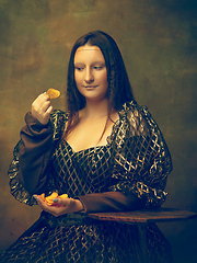 Image showing Young woman as Mona Lisa on dark background. Retro style, comparison of eras concept.