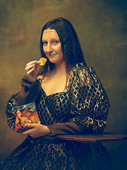 Image showing Young woman as Mona Lisa on dark background. Retro style, comparison of eras concept.