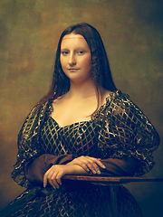 Image showing Young woman as Mona Lisa on dark background. Retro style, comparison of eras concept.