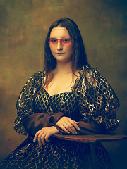 Image showing Young woman as Mona Lisa on dark background. Retro style, comparison of eras concept.