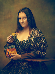 Image showing Young woman as Mona Lisa on dark background. Retro style, comparison of eras concept.