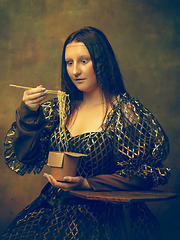 Image showing Young woman as Mona Lisa on dark background. Retro style, comparison of eras concept.