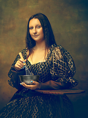 Image showing Young woman as Mona Lisa on dark background. Retro style, comparison of eras concept.