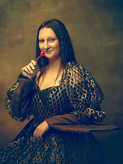 Image showing Young woman as Mona Lisa on dark background. Retro style, comparison of eras concept.