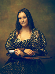 Image showing Young woman as Mona Lisa on dark background. Retro style, comparison of eras concept.
