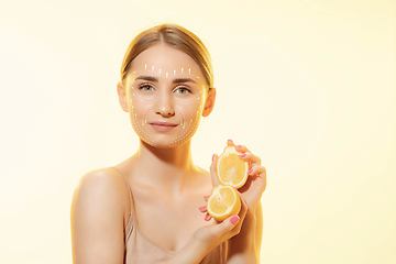 Image showing Youth secrets. Beautiful young woman over white background. Cosmetics and makeup, lifting and aging concept.