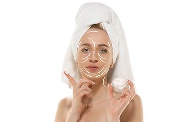 Image showing Youth secrets. Beautiful young woman over white background. Cosmetics and makeup, lifting and aging concept.