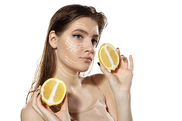 Image showing Youth secrets. Beautiful young woman over white background. Cosmetics and makeup, lifting and aging concept.