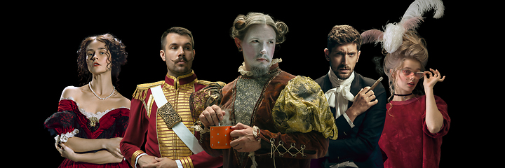Image showing Collage on young people in medieval attire on dark background. Retro style, comparison of eras concept.