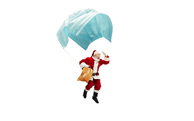 Image showing Santa Claus flying on huge face mask like on balloon isolated on white background