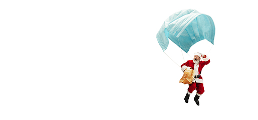 Image showing Santa Claus flying on huge face mask like on balloon isolated on white background