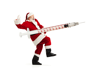 Image showing Santa Claus holding huge vaccine against COVID like Christmas gift isolated on white background