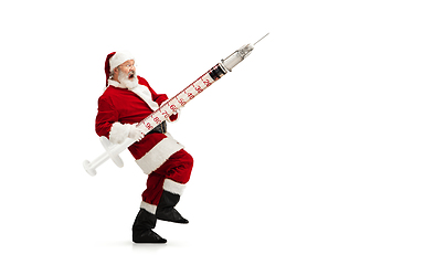 Image showing Santa Claus holding huge vaccine against COVID like Christmas gift isolated on white background