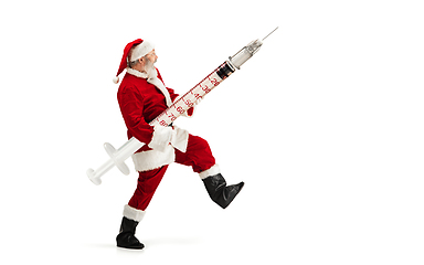 Image showing Santa Claus holding huge vaccine against COVID like Christmas gift isolated on white background