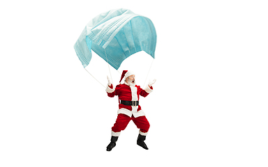 Image showing Santa Claus flying on huge face mask like on balloon isolated on white background