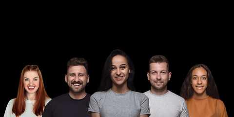 Image showing Group portrait of emotional people on black studio background